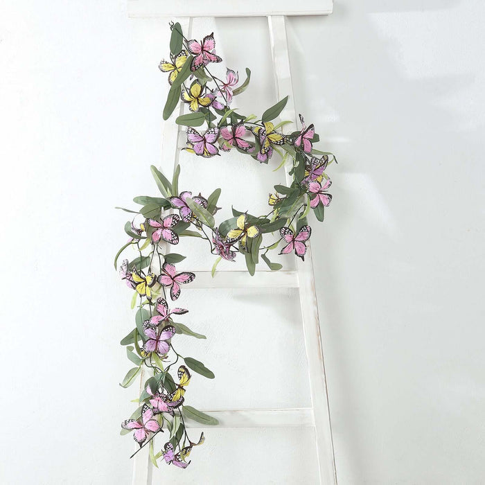 Colorful butterfly garland displayed on a white ladder