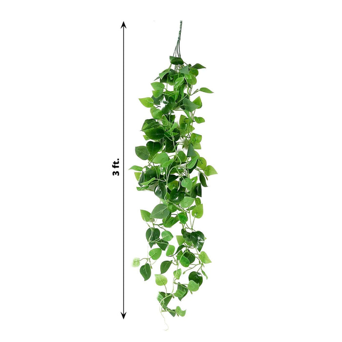 Artificial hanging plant vine, 3 ft long, vibrant green leaves.