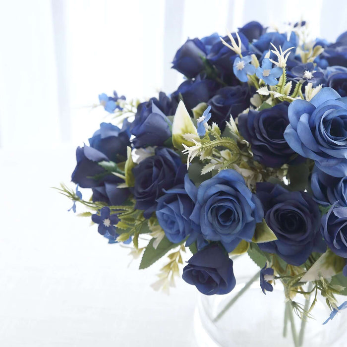 Blue rose bouquet arrangement in a clear vase. #whtbkgd