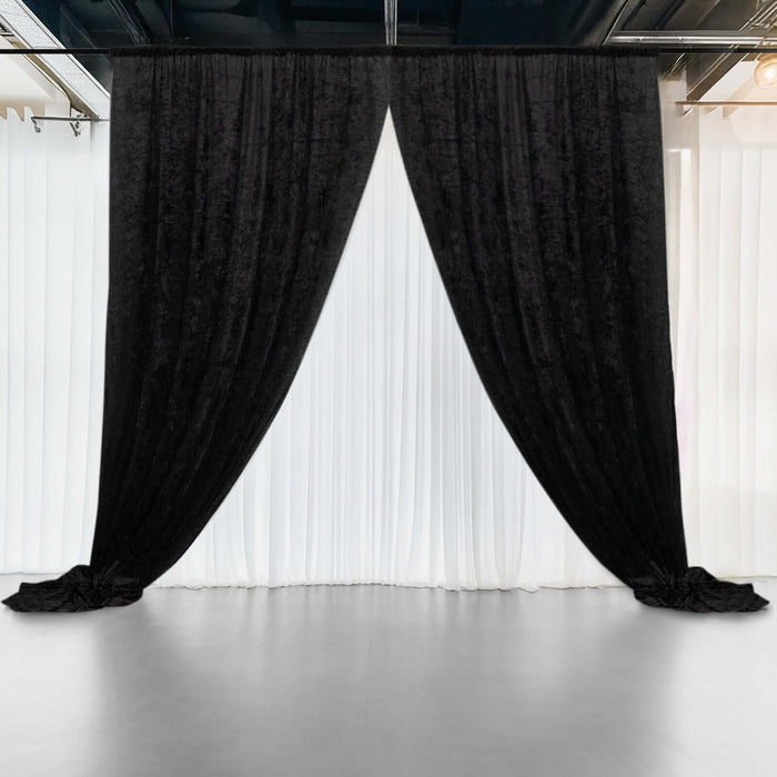 Black velvet curtains draped elegantly against a white backdrop