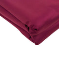 Burgundy fabric roll with smooth texture and rich color