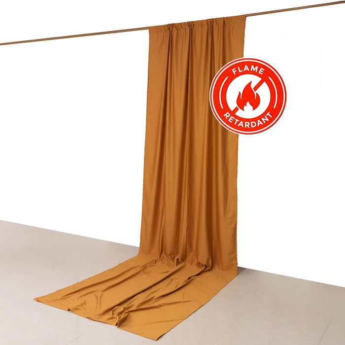 Flame-retardant fabric curtain in warm golden color against a plain backdrop