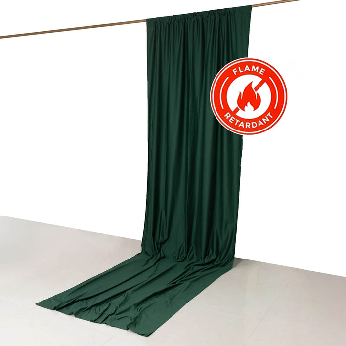 Flame retardant green curtain draped on a rod