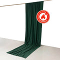 Flame retardant green curtain draped on a rod