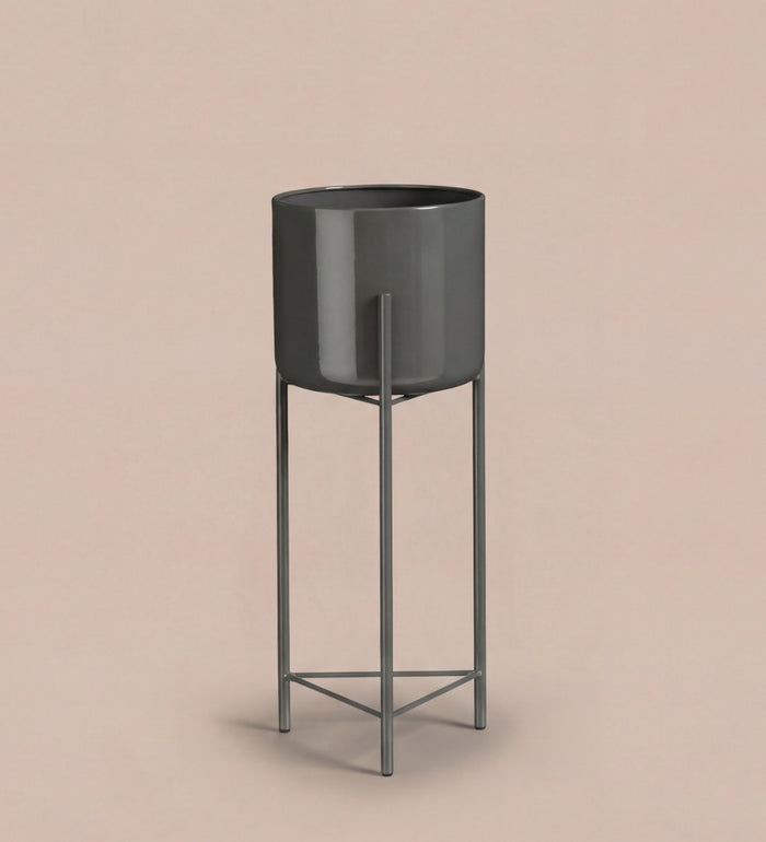 Large black pot on stand
