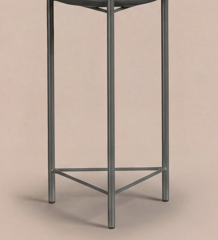 Large black pot on stand