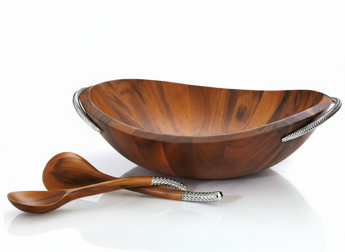 A brown acacia wood salad bowl with chrome plate handles and a serving spoon, designed by Sean O'Hara.