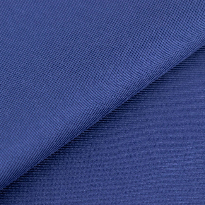 Navy blue textured fabric in a studio isolation shot.
