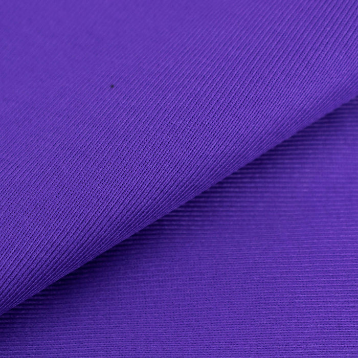 Purple textured fabric with a soft finish, ideal for various sewing projects.