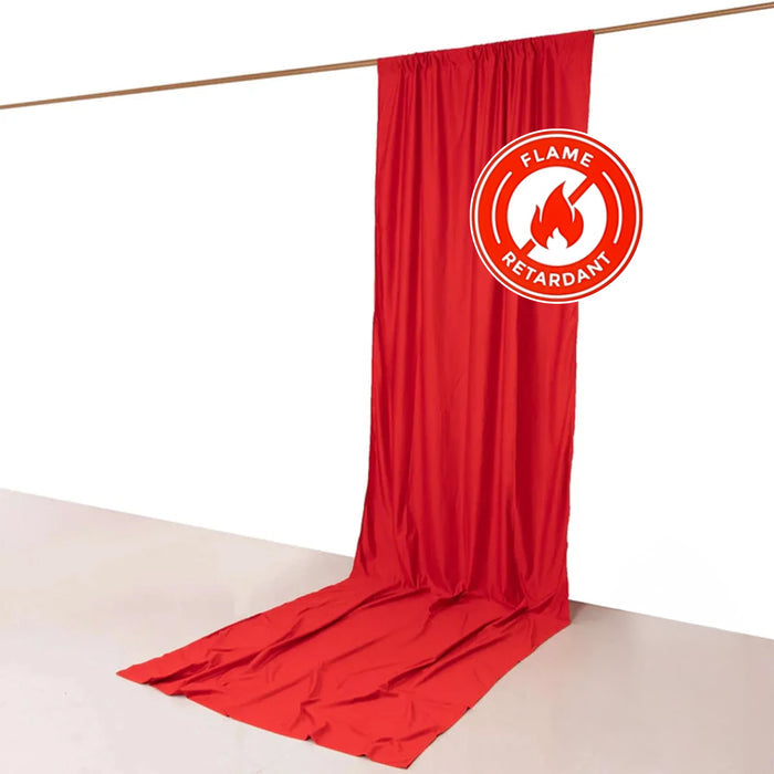 Red flame-retardant fabric drape on a white backdrop.
