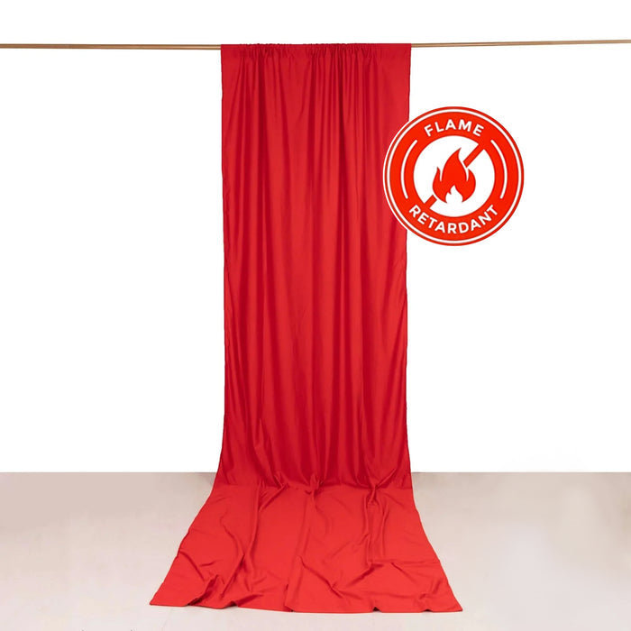 Red flame-retardant curtain draped on a rod against a white background.