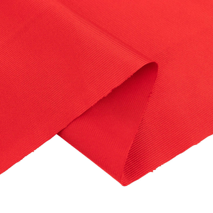 Red fabric with a textured finish, showcasing folds and drapes.