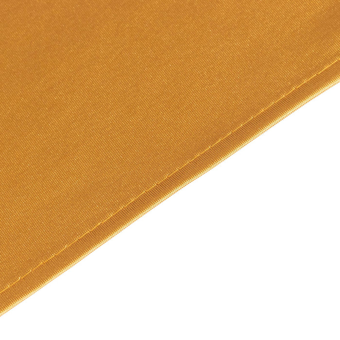Close-up of a golden yellow fabric texture.