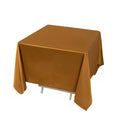 Brown tablecloth on a square table, elegantly draped for a clean look.