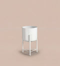 Small white pot on stand