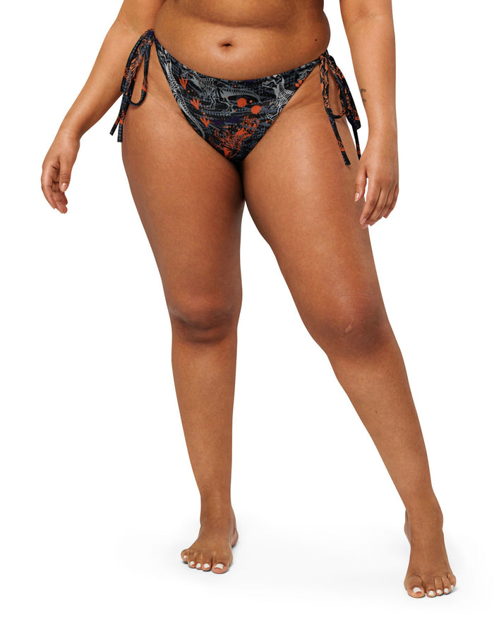 Model wearing the T-Wrecked String Bottoms by One Stop Rave.