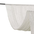 White sheer fabric draped elegantly on a rod