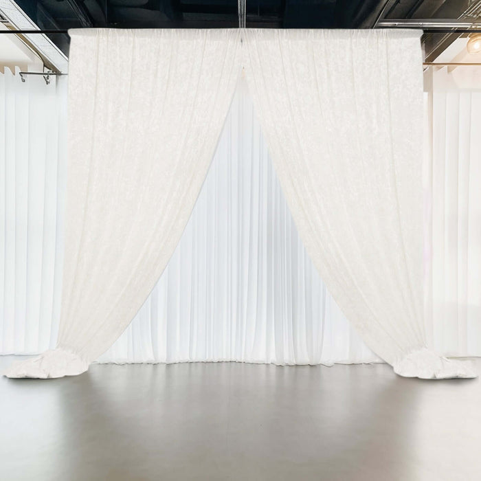 White fabric drapes elegantly in a studio setting