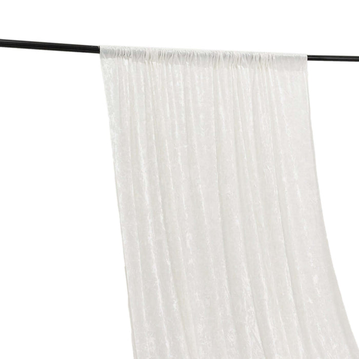 White sheer curtain panel hanging on a black rod