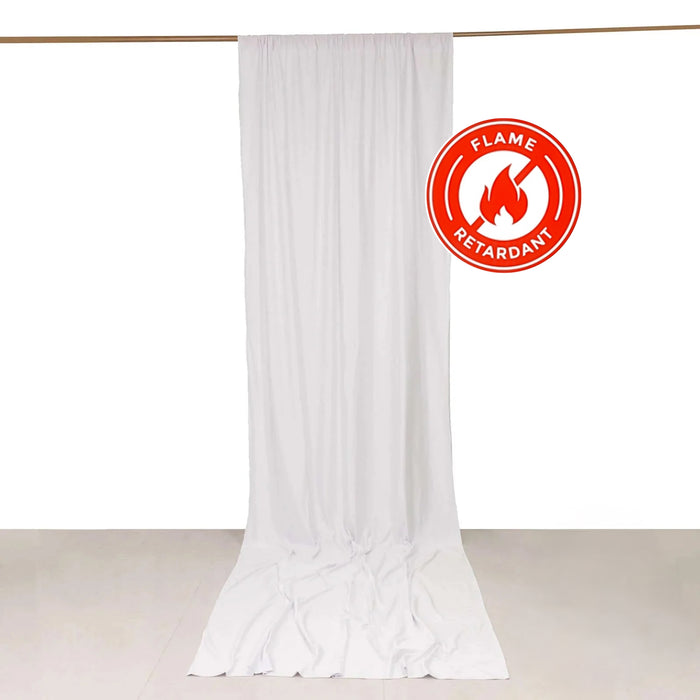 White flame-retardant fabric curtain hanging against a plain backdrop