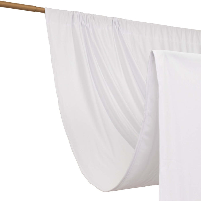White fabric drape on a wooden rod, ideal for photography backdrops.